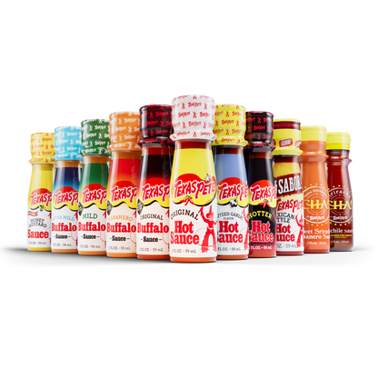 Row of various Texas Pete hot sauce bottles