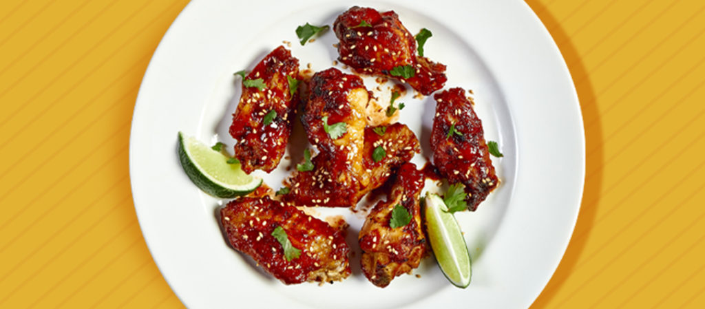 wide image of spicy and sweet cha wings by texas pete
